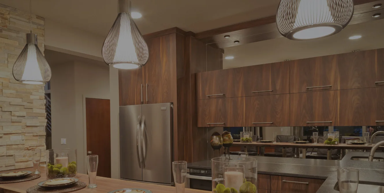 Modern kitchen interior view with dark wood cabinets by Build America Constructions