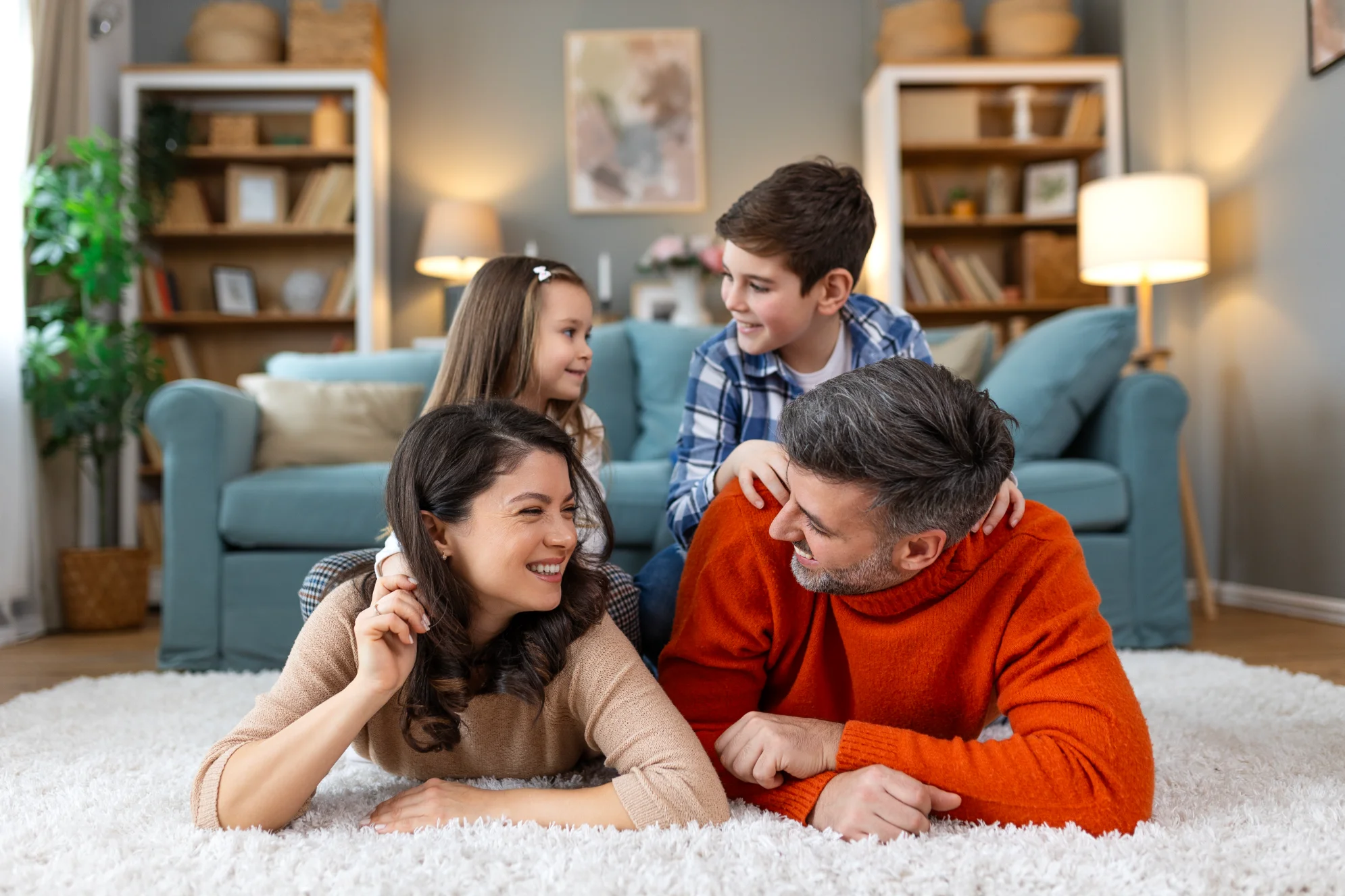 Happy family smiling in a beautifully finished BA Construction home in Florida